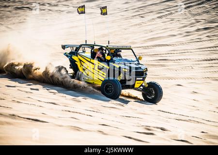 Doha, Qatar- April 22,2022: Off road buggy car in the sand dunes of the Qatari desert. Stock Photo