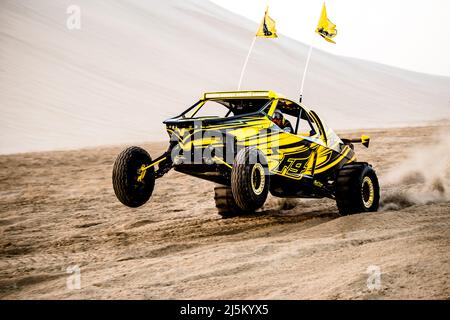 Doha, Qatar- April 22,2022: Off road buggy car in the sand dunes of the Qatari desert. Stock Photo