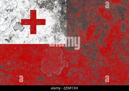 Tonga flag on a damaged old concrete wall surface Stock Photo