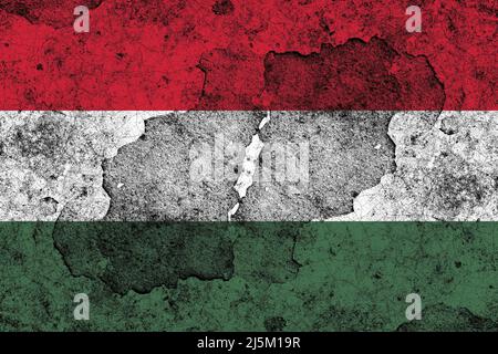 Hungary flag on a damaged old concrete wall surface Stock Photo