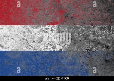 Netherlands flag on a damaged old concrete wall surface Stock Photo