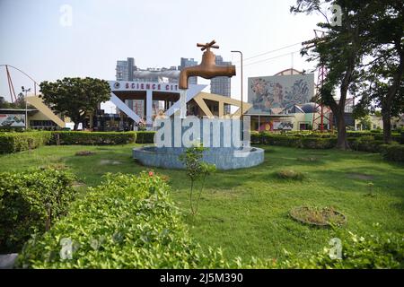 Giant Magic Tap, an outdoor floating tap fountain hovering above a pool, with endless supply of water gushing out of it, seemingly from nowhere. Scien Stock Photo