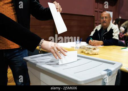 Kranj, Slovenia. 24th Apr, 2022. Voters cast their ballots during the 2022 Slovenian parliamentary elections in Kranj. A record turnout is expected, while polls suggest a tight race between Prime Minister Janez Jansa's Slovenian Democratic Party (SDS) and the Freedom Movement, a new party headed by Robert Golob. (Photo by Luka Dakskobler/SOPA Images/Sipa USA) Credit: Sipa USA/Alamy Live News Stock Photo