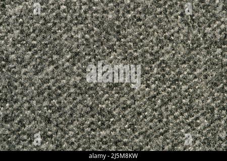 Dark gray swatch of carpet sample, closeup directly above full frame image. Stock Photo