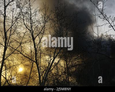 A fire after an explosion at an industrial plant in a large industrial city. Stock Photo