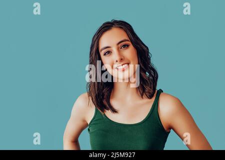 woman looking at camera with a pleasant smile studio portrait Stock Photo