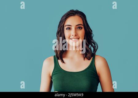 woman looking at camera with a pleasant smile studio portrait Stock Photo