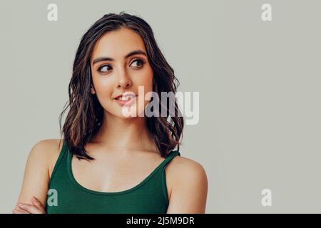 Young woman looking to the side at copy space studio portrait Stock Photo