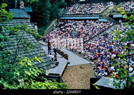 A summer evening concert at Echo Hollow Amphitheatre in Silver Dollar City near Branson, Missouri provides entertainment for hundreds. Stock Photo
