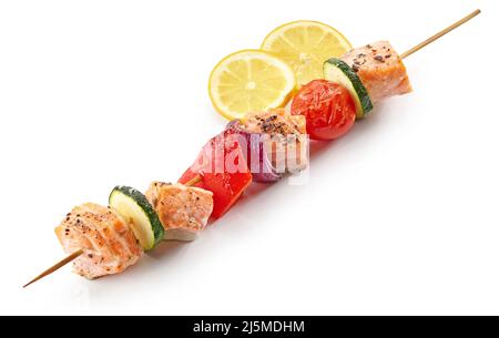 grilled salmon and vegetable skewer and lemon slices isolated on white background Stock Photo