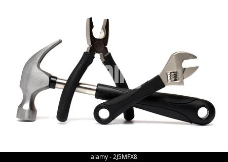 Close up of a claw hammer of a combination pliers and adjustable wrench with black rubberized handle on white background as a concept for craft and to Stock Photo