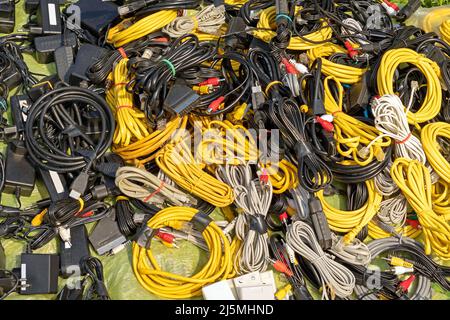 Large pile of different connection cables sold on outdoors market Stock Photo