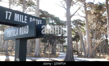 Scenic 17-mile drive wooden road sign, Monterey peninsula, Big Sur, California, USA. Coastal roadtrip, cypress forest. Pacific coast highway tourist route. Hitchhiking trip, ecotourism on vacations. Stock Photo