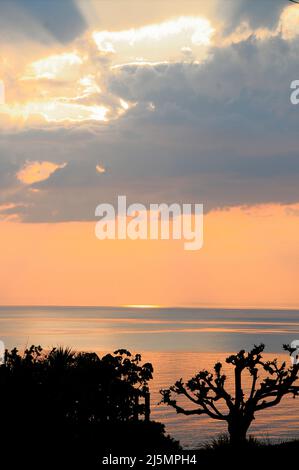 Isle of Portland. 24th April 2022. UK Weather. A pastel sunset over Lyme Bay, Isle of Portalnd. Credit: stuart fretwell/Alamy Live News Stock Photo