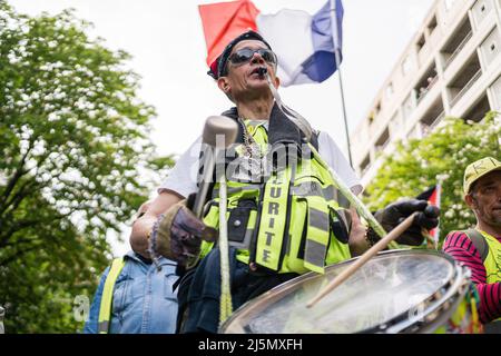 Paris, France. 23rd Apr, 2022. Protester seen drums while marching on the streets of Paris. Demonstration on the streets of Paris, France, a day before the presidential elections between Emmanuel Macron and Mariane Le Pen. The protesters show their discontent with both political options. Credit: SOPA Images Limited/Alamy Live News Stock Photo