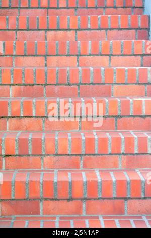 Red and orange bricks staircase at San Francisco, California. Close-up of an outdoor staircase with red and orange bricks threads and riser. Stock Photo