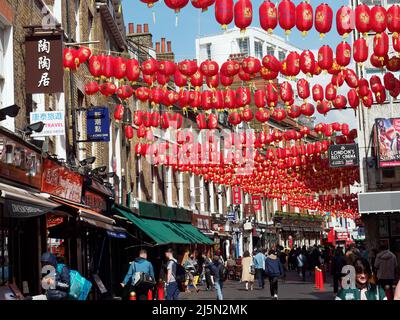 A view along Lisle Street in London's Chinatown decorated with hanging red lanterns Stock Photo