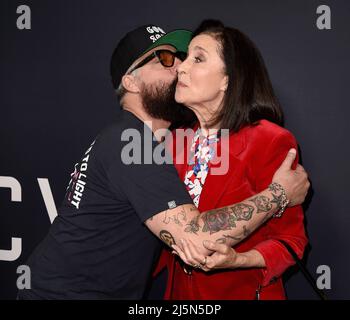 Titus Welliver and Mimi Rogers walking on the red carpet at the