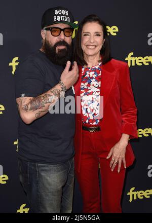 Titus Welliver and Mimi Rogers walking on the red carpet at the