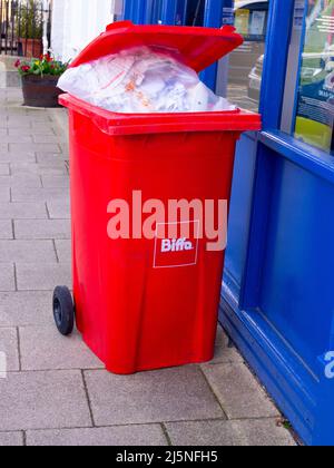 Red Biffa waste wheelie bin Stock Photo - Alamy