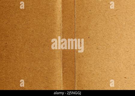 Brown cardboard sheet with two stripes in the center, paper texture background Stock Photo
