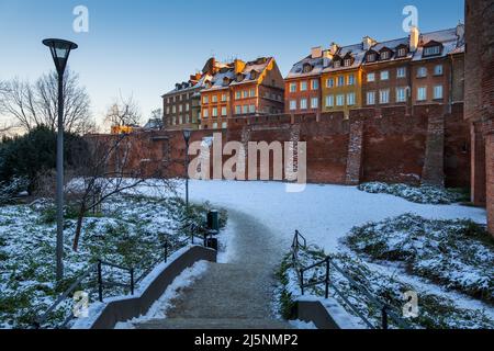 Winter at walled Old Town at sunset in city of Warsaw in Poland. Stock Photo