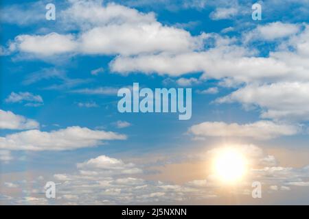 blue sky during a sunny day with sunlight. sun somes clouds. white cloud on blue sky. some white whispy clouds and sunny blue sky cloudscape. Beautifu Stock Photo
