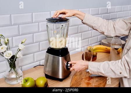 Premium Photo  Making a milkshake with an electric hand mixer refreshing  drink by the hands of the chef