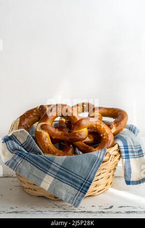 Brezels or pretzels in bread basket with napkin  Stock Photo
