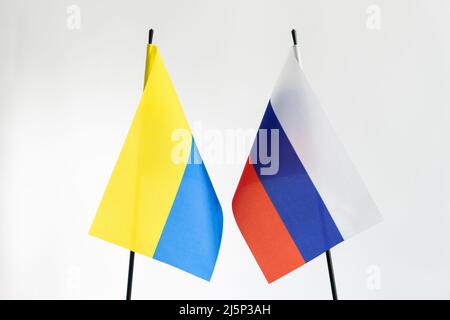 State flag of Russia and Ukraine on white background. Russian Ukrainian war conflict concept Stock Photo