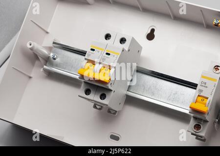 Protective electric devices on a din rail. Stock Photo