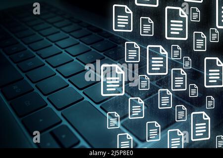 Laptop keyboard with Document Management System (DMS) concept. Process automation to efficiently manage files. Stock Photo