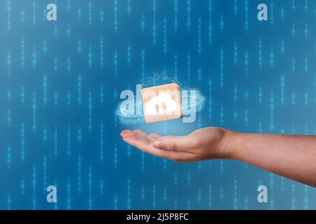 Woman hand showing icon cloud computing with blue background and copy space. Cloud technology. Data storage. Networking and internet service concept. Stock Photo