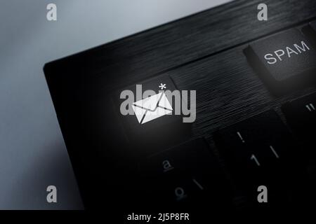 Keyboard with spam icons on buttons. Keyboard to protect and blocking spam email from internet and hacker. Smart technology concept. Stock Photo