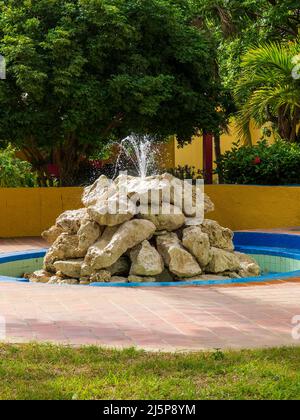 Relaxing resort water fountain made from large boulders Stock Photo