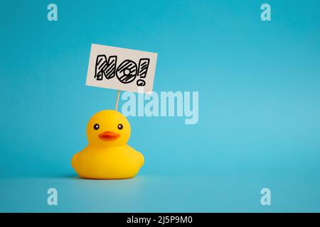 Rubber duck carries a signboard with the word no. Political activism and voting concept. Stock Photo