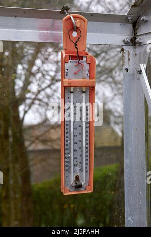 Max and Min greenhouse thermometer with broken magnet holder Stock Photo