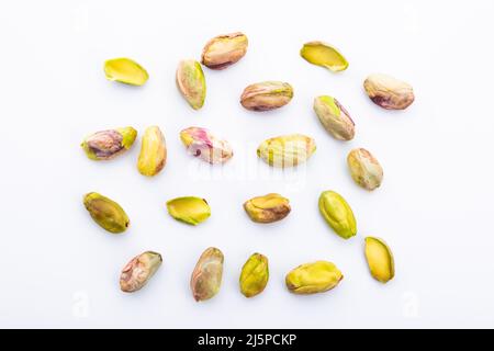 peeled pistachios on white background Stock Photo