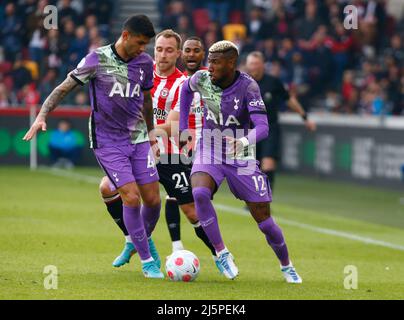 London, England - APRIL 23: Christian Eriksen of Brentford takes on Tottenham Hotspur's Emerson Royal and Tottenham Hotspur's Cristian Romero (on loan Stock Photo