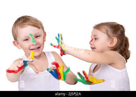 Small children draw on each other with finger paints, on a white background Stock Photo