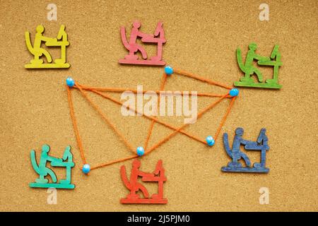 Communication in company. Thumb tacks connected with a rope. Stock Photo