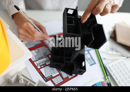Female architect working at new house project Stock Photo