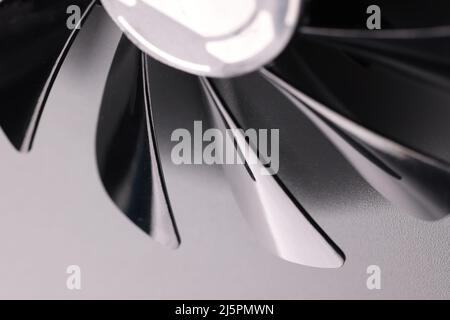 Cooling fan with plastic black blades on grey background Stock Photo