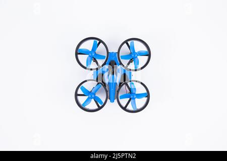 a small toy quadrocopter isolated on white background Stock Photo
