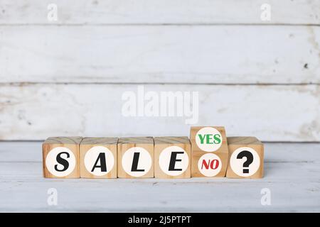 sales word is made of wooden building blocks, white wooden background Stock Photo