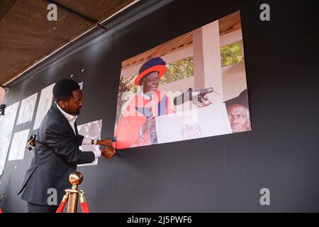 Nairobi, Kenya. 25th Apr, 2022. A man seen mounting a portrait bearing the image of the late president Mwai Kibaki at Parliament Buildings. The 90 year old former head of state died on February 22, 2022 as announced by the current president Uhuru Kenyatta. (Photo by John Ochieng/SOPA Images/Sipa USA) Credit: Sipa USA/Alamy Live News Stock Photo