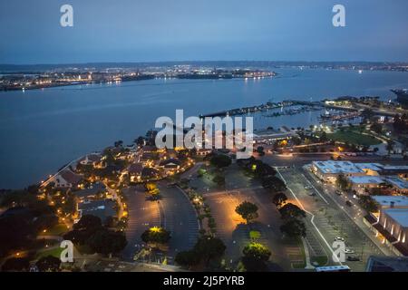 Aerial panoramic view of San Diego Bay and the Seaport Village (waterfront shopping, dining and entertainment complex) at dusk Stock Photo