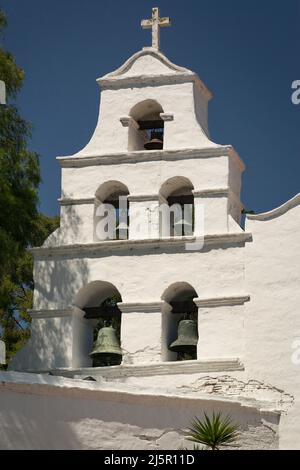 Close-up view of the five bells of the Mission Basilica San Diego de Alcala (first Franciscan Mission in California) bell tower in San Diego Stock Photo