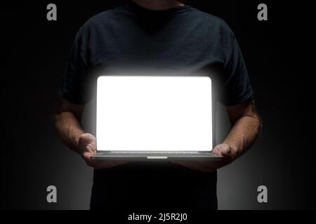 Man holding laptop Stock Photo