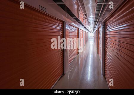 Inside dark self storage facility Stock Photo